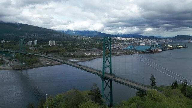 aerial shot of the Lions Gate Bridge in Vancouver City on a cloudy day; British Columbia, Canada