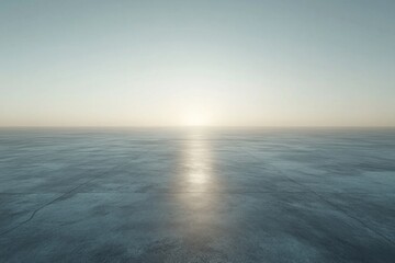 Fototapeta premium Calm sunrise over a flat, textured surface.
