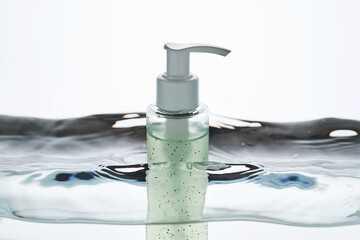 A bottle of cosmetic product in water.