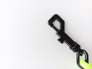 Metal carabiner on a white background. Climbers' belay fastenings.