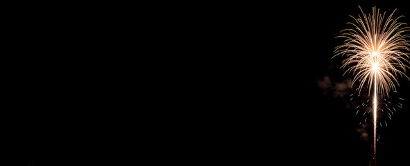 Bright fireworks explode in various colors, illuminating the night sky with a stunning spectacle, generative ai