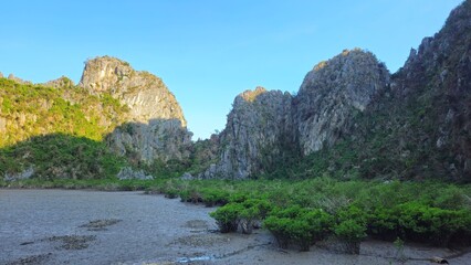 Close-up view of the dome-shaped limestone mountain at Ha Long Bay, Vietnam in a sunny day.