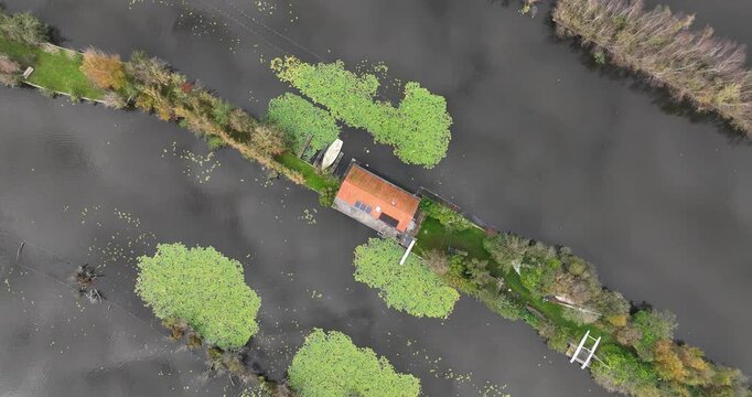 Small houses at the Loosdrechtse Plassen, Scheendijk, marina of Breukelen, The Netherlands, nature reserve with tow holes and legakkers