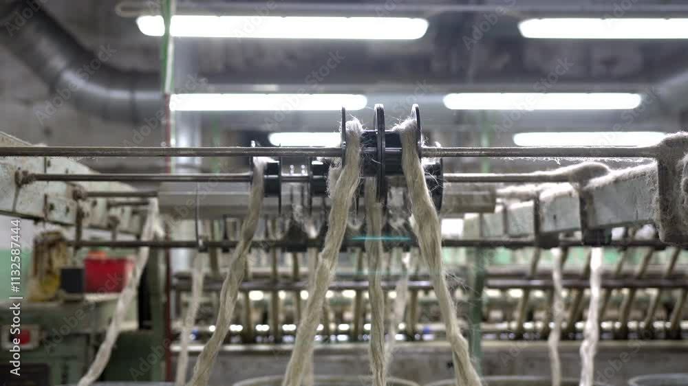 Poster a wide shot showcasing flax fibers being processed on a mass-production line, emphasizing large-scal