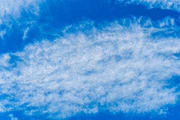 cloudy sky background for wallpaper and design, day skyscape with white beautiful clouds and blue...