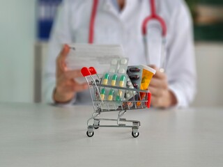 A basket of medicines and a doctor preparing a prescription at the pharmacy.