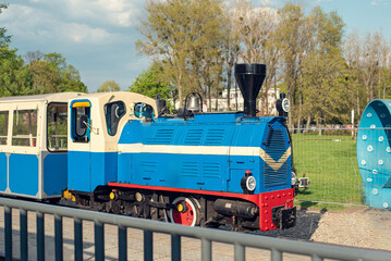 Children's railway in the park near Lake Malta in Poznań, offering fun rides for kids © Yunona
