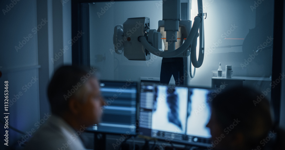 Poster radiologists analyze chest x-rays in a medical monitoring room, examining digital scans on a compute