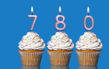 Birthday Cupcakes With Candles Lit Forming The Number 780