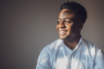 Obraz premium Portrait of happy man who is smiling and looking away.