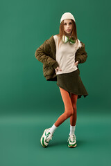 A young woman in green confidently displays her unique style while battling anorexia.