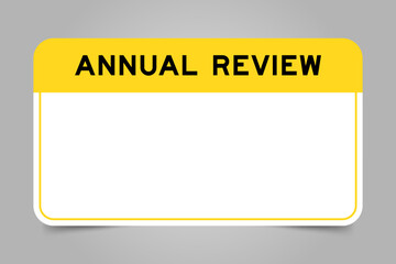 Label banner that have yellow headline with word annual review and white copy space, on gray background