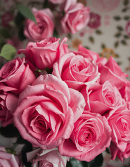 Bouquet of pink roses close up, toned, soft focus. Floral vintage background, with white tones