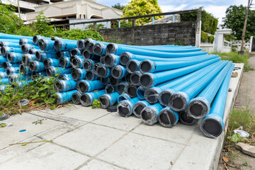 Polyvinyl chloride Drainage Pipe on a Construction Site. Polyvinyl chloride drainage pipes stacked...