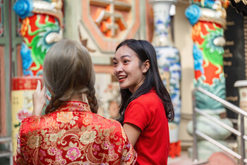 Worshiping at a shrine during chinese new year celebrations urban setting festival cultural atmosphere joyful gathering
