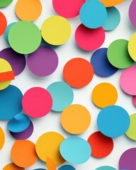Fototapeta premium A vibrant array of colorful paper circles in various sizes, creating a cheerful and playful atmosphere.