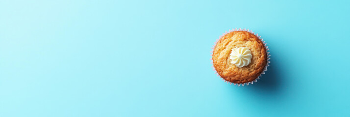 Obraz premium National muffin day horizontal banner 3:1 cupcake with cream frosting on a blue background. Cup cake template for product presentation display copy text space banner creative pastel colors