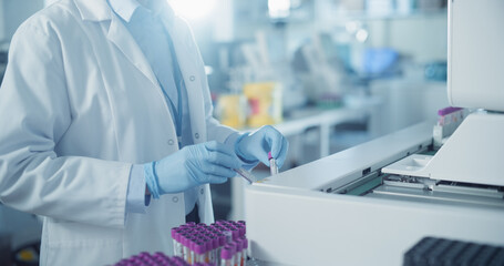 Skilled Laboratory Technician Operating Advanced Diagnostic Equipment, Processing Blood Samples....