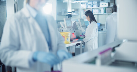 Asian Biomedical Scientist Testing Out Clinical Specimens to Obtain Information About Patient...