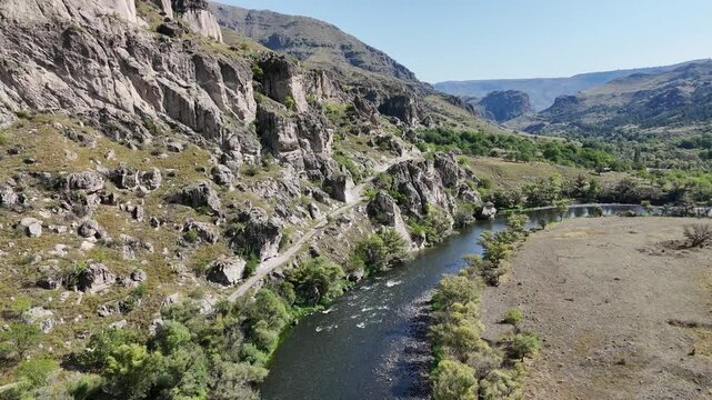 Aerial view of Kura River valley and Erusheti rocky mountain next to Vardzia cave monastery in Georgia.