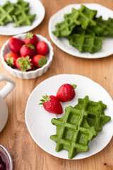 Healthy Breakfast: Green Waffles with Fresh Strawberries and Coffee