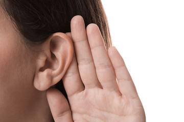 Woman showing hand to ear gesture on white background, closeup