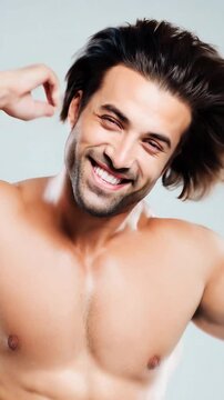 Happy 35 year old man, pulling on his strong and healthy hair, after a hair implant treatment.