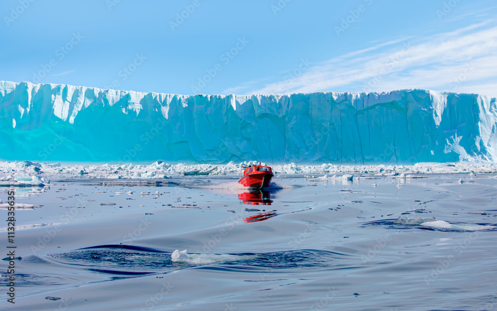 Wall mural fast moving motorboat trying to get out of the ice - stranded icebergs in the fog at the mouth of th
