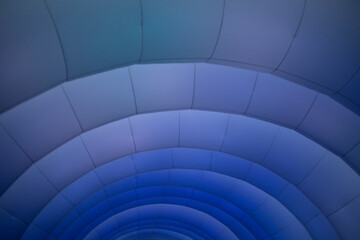 Inflatable structure in detail. Texture of arc lines. Purple glow on the structure.