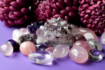 Real Amethyst and Rose Quartz Crystals on Burgundy Chrysanthemum Background. Healing Crystals....