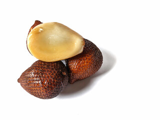 Selective focus on snake fruit or buah salak or Salacca zalacca isolated on white background.