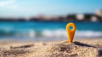 Obraz premium Yellow Location Pin on Sandy Beach with Ocean in Background