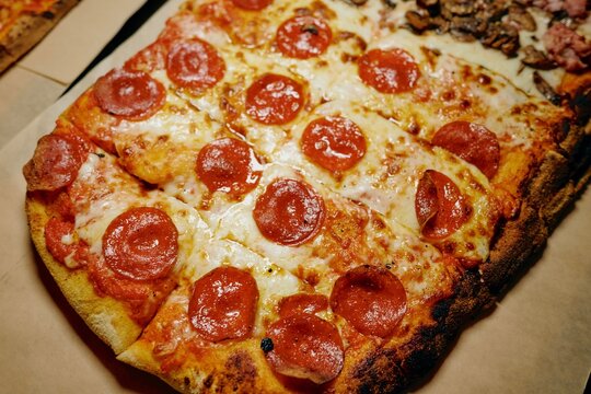 Pepperoni rectangle pan pizza on a board