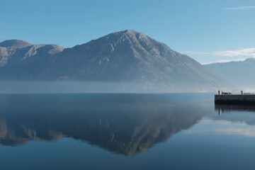 Serene mountain landscape reflection on calm waters