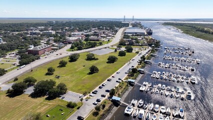Southern coastal city Brunswick, Georgia historic golden isles vacation destination with marina, historic architecture outdoor parks under warm sunny sky and protected wetlands for wildlife © Steve