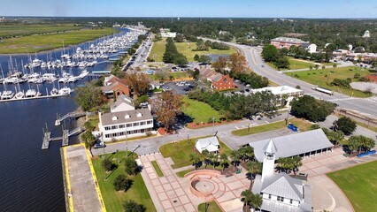 Southern coastal city Brunswick, Georgia historic golden isles vacation destination with marina, historic architecture outdoor parks under warm sunny sky and protected wetlands for wildlife © Steve