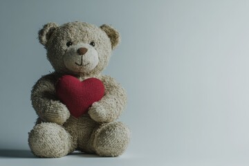 Obraz premium A charming teddy bear sits cheerfully, clutching a red heart, evoking warmth and affection. With soft textures and gentle colors, it perfectly represents Valentine's Day joy