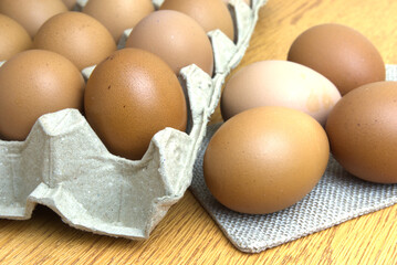 Close-up of chicken eggs on a wooden table