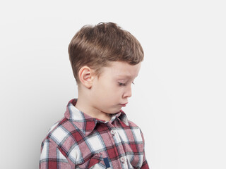 An upset child with a sad expression: Reflecting emotions and vulnerability in difficult childhood moments