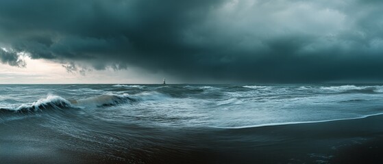 Tumultuous waves crash onto a stormy beach under dark, imposing clouds, capturing the raw beauty and unpredictability of nature.