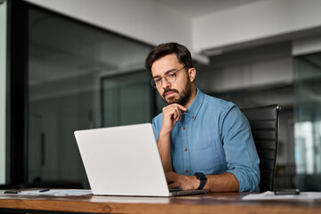 Young professional busy business man executive leader using laptop working in office, busy ceo...