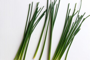 Obraz premium Isolated Green Chive Stems on Clean White Background