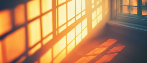 Warm sunlight casts a grid of geometric shadows through a sunlit window, creating a serene glow in the quiet room.