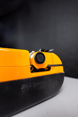 Bright Yellow Retro Typewriter Set Against a Dark Background