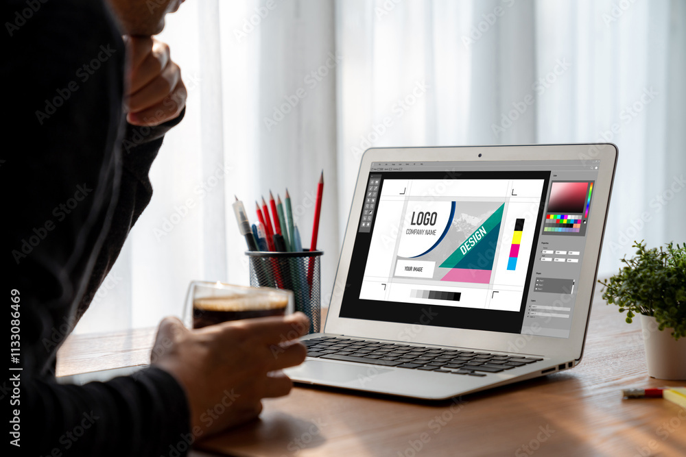 Poster graphic designer software for modern design of web page and commercial ads showing on the computer s