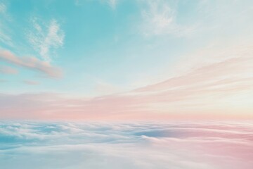 Serene sunrise sky with soft clouds in pink and blue hues