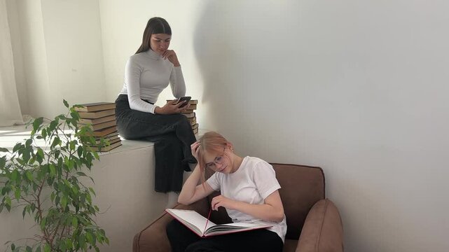 Students preparing for the new school year while studying indoors. Back to school.