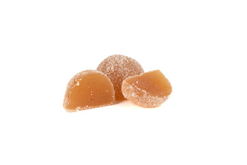 Two halves and a whole marmalade with sugar isolated on white background.