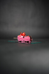 Naklejka premium Delicious Pink Dessert Decorated With Strawberries and Chocolate