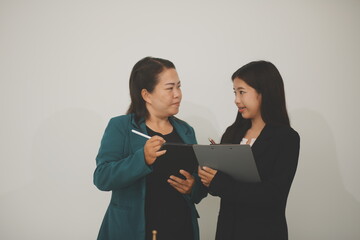 Pretty Asian female lawyer working and hammer, laptop, justice advice and legal concept. In office